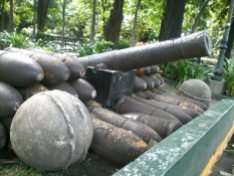 A real canon gun with all its unused canon balls used by the Spaniards to protect the walled city during their era.